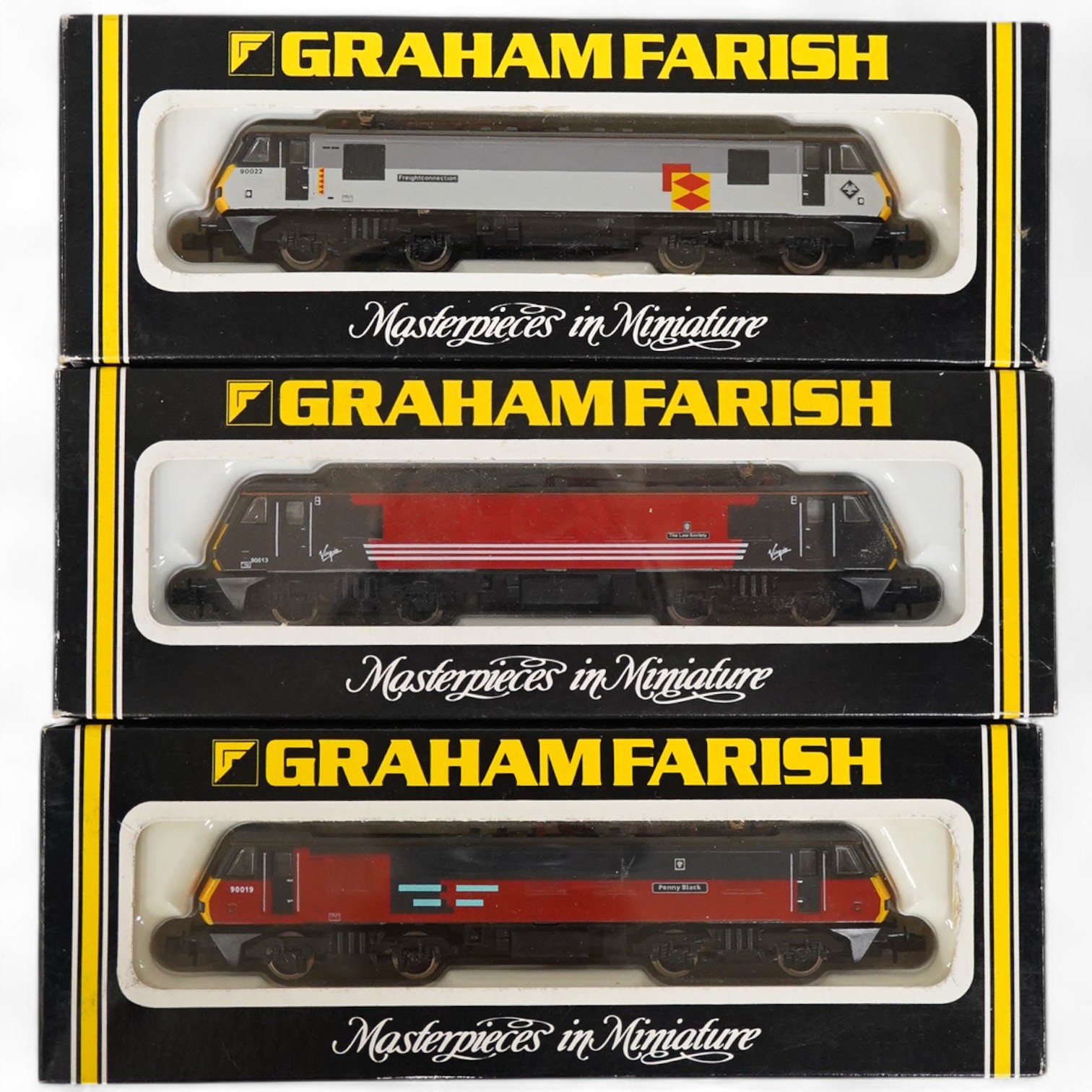 Three boxed Graham Farish N gauge railway Class 90 electric locomotives; BR 90022 Freight connection (8828), Virgin 90013 The Law Society (882A) and Rail Express 90019 Penny Black (8825). Condition - good.